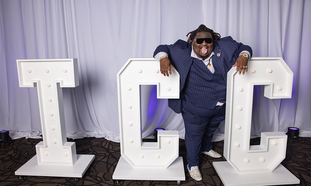 BMC - Sheann Stokes-Gilmore poses with the "TCC" letters at the TCC Foundation Vision Dinner.