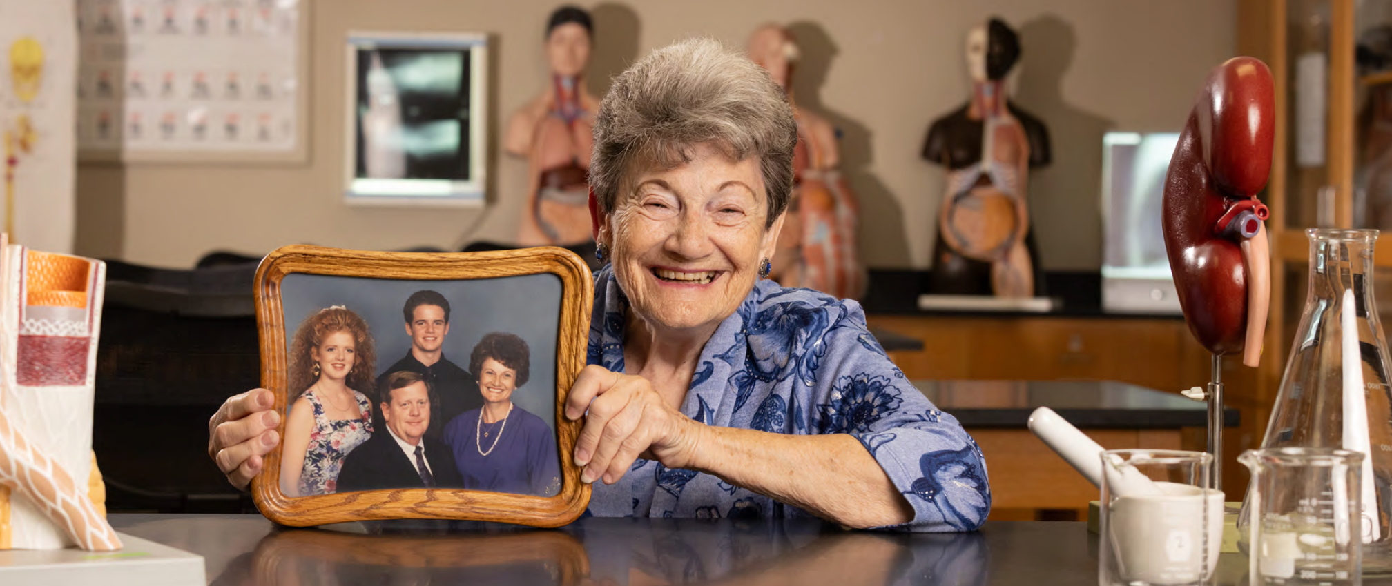 TCC scholarship donor Wanda Wolfkill holds a photo of here family.