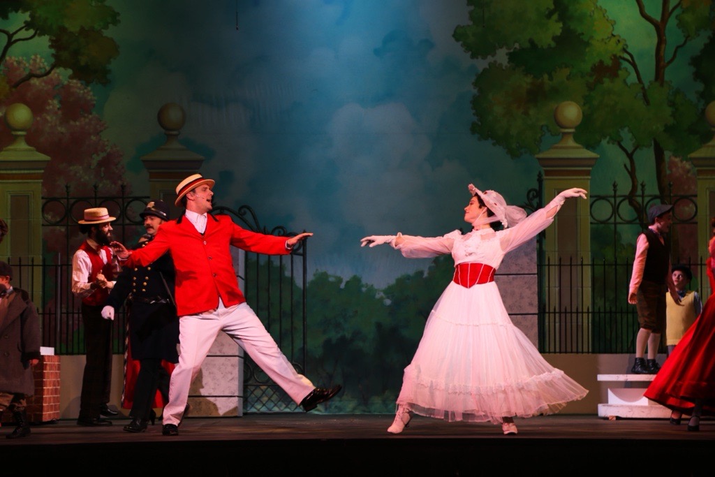 Characters Mary Poppins and Bert perform a musical number together.